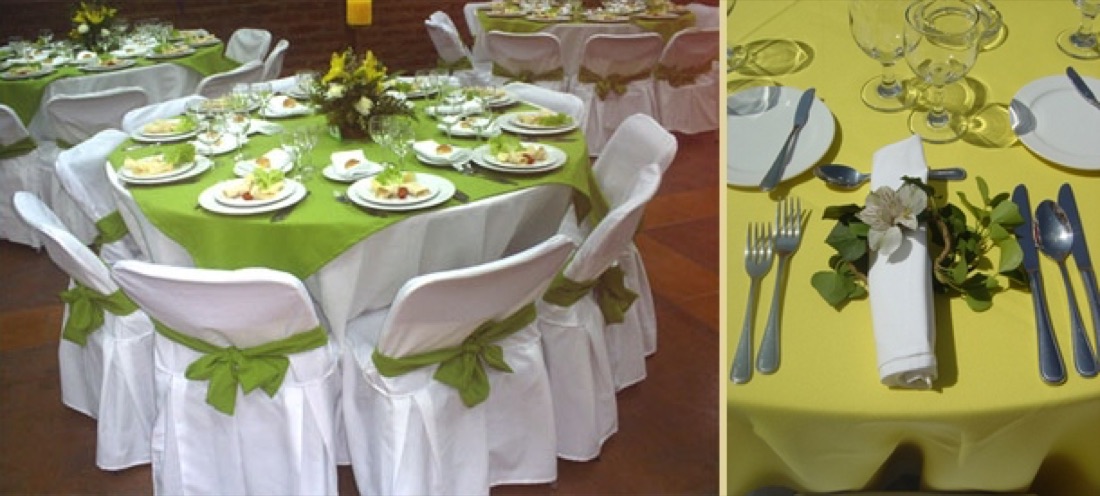 Mesa redonda con mantel marrón, platos base dorados con cuencos blancos, copas de agua y vino